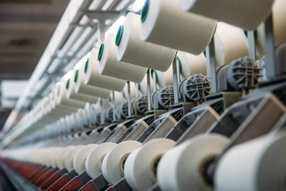 Yarn cones feeding a textile production line