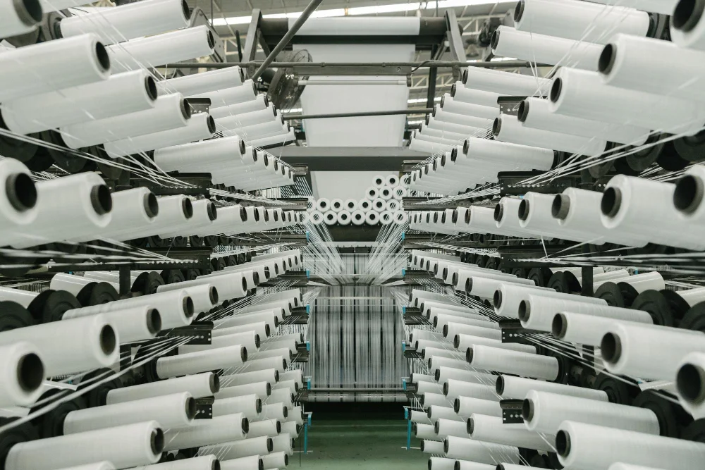 Rows of yarn cones in textile production